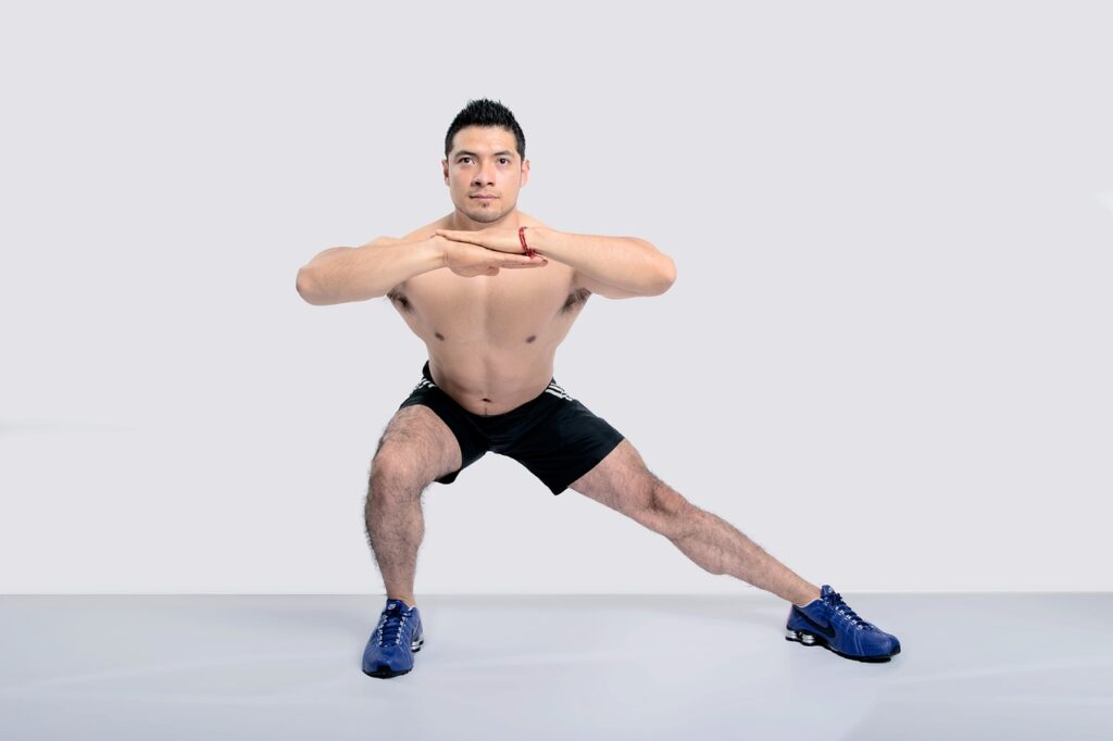 A man is performing leg exercise