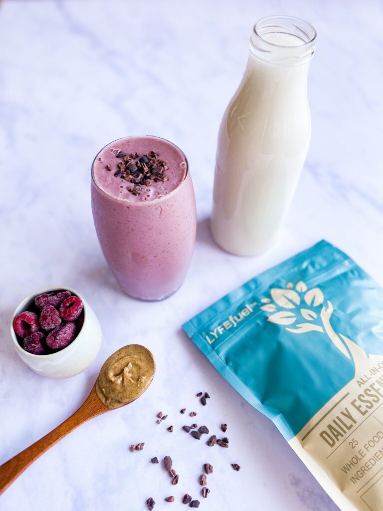 Oat milk shake with berries, flaxseed, and plant-based protein powder